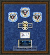 Police Department retirement shadow box with police badges, patches, ID cards and lapel pins.
Kennesaw_Mirror_Hanger.jpg