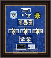 Cobb County Police Department retirement shadow box with police badges, patches, ID cards and lapel pins.
police-shadowbox-badges-patches.jpg
